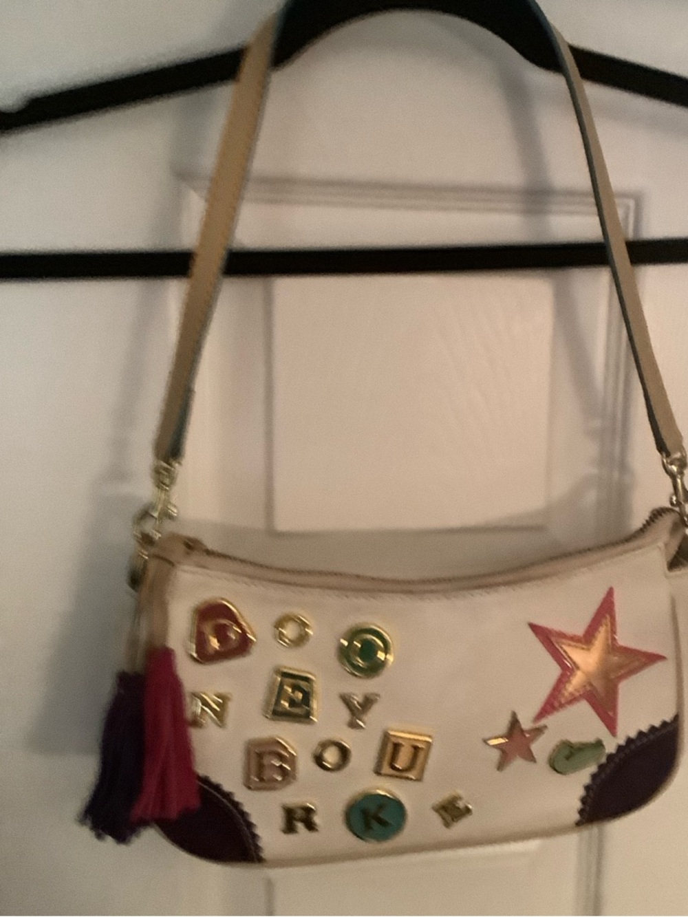 Lindsay Lohan Star Appliqué leather Bag with Multicolor Accent tiles and stars.